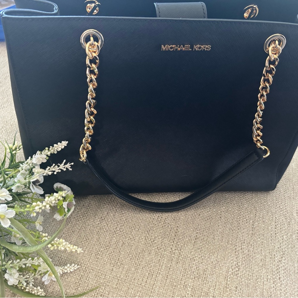 Purse new with tags black and gold colors three compartment